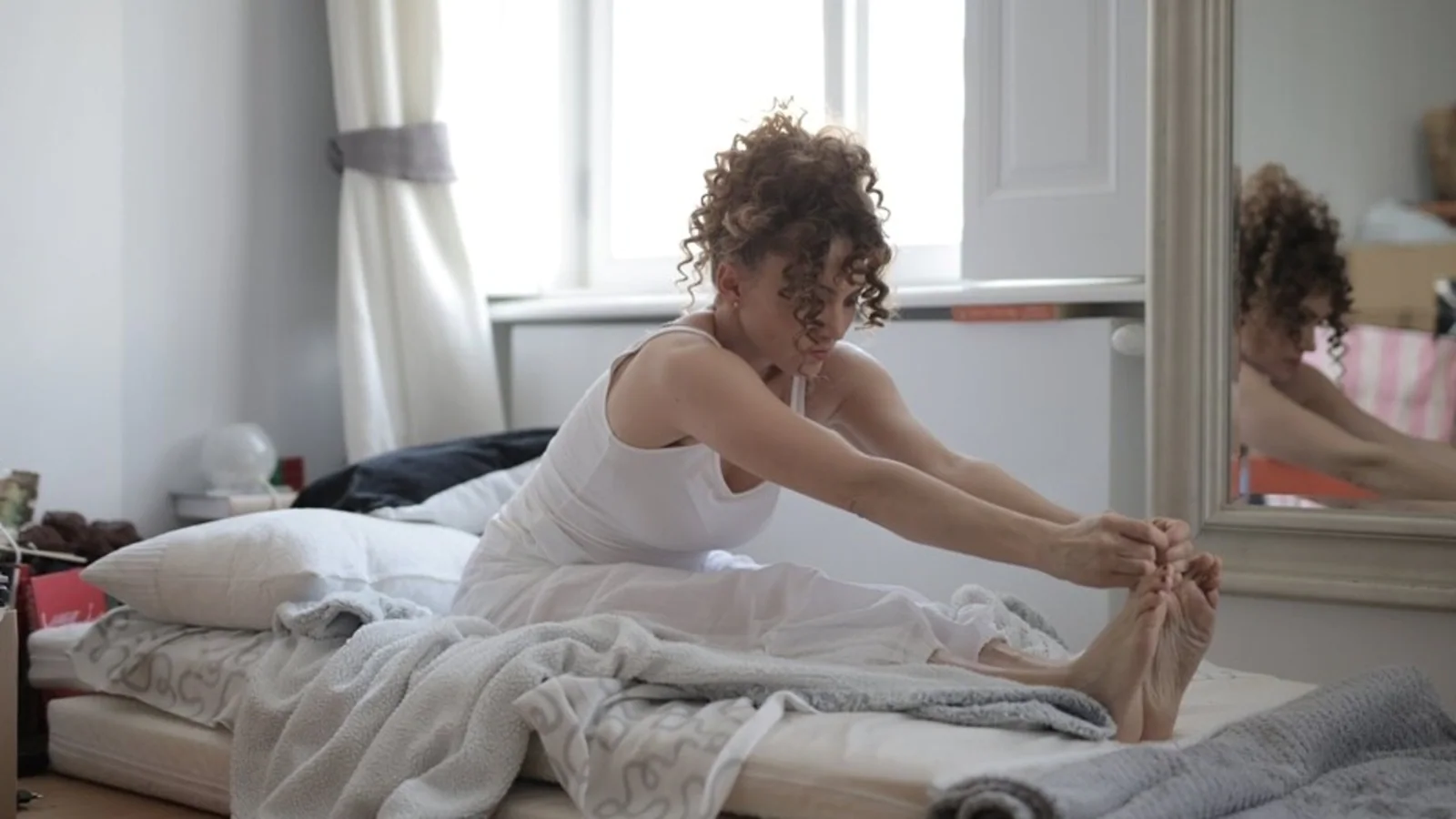 Too tired to hit the gym? 6 exercises you can do from your bed