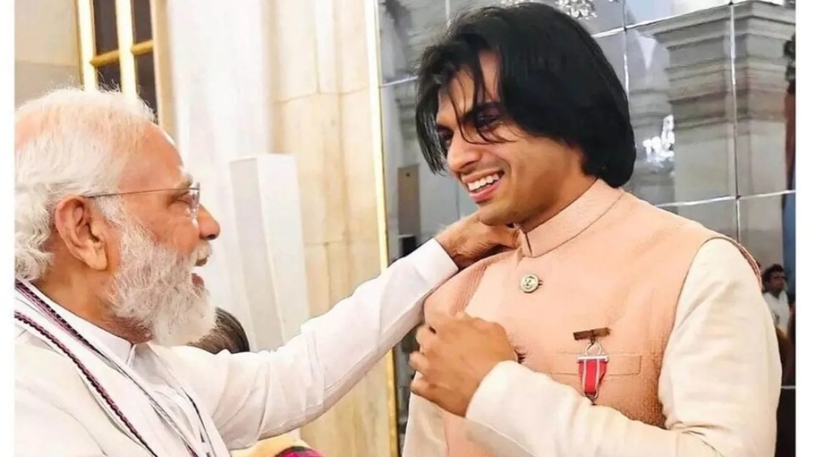 Neeraj Chopra poses with PM Narendra Modi in blush pink kurta pyjama and jacket by Sabyasachi in this pic: See here