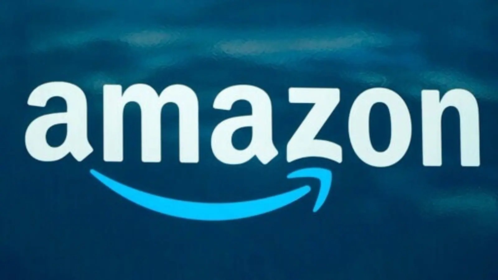 Amazon reports rare quarterly loss as online shopping slows