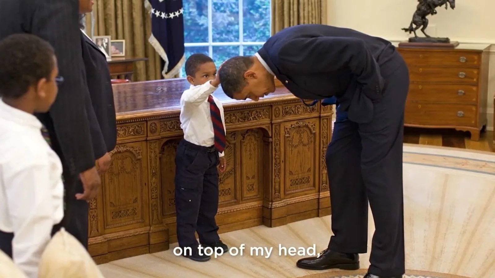 Obama shares reunion video with boy who touched his hair in iconic photo in 2009