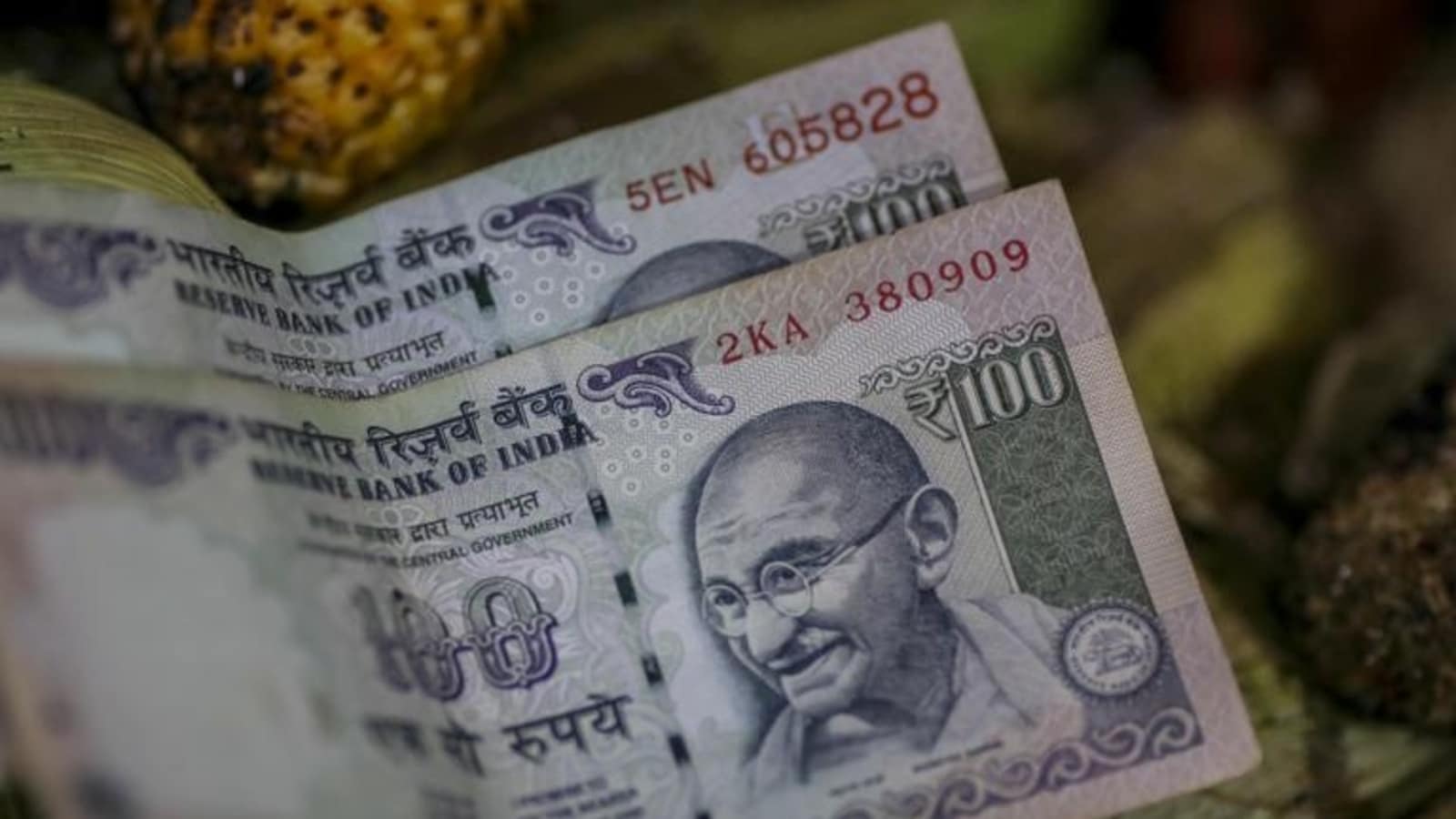 Rupee slumps 10 paise to close day at record low of 77.72 against dollar